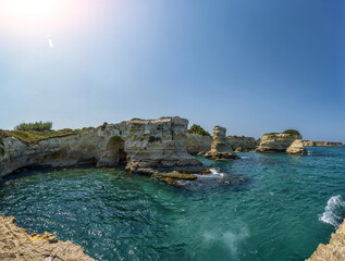 Melendugno,province of Lecce, Puglia, Italy. August 2021. The stacks of Sant'Andrea are a point of...