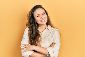 Obraz premium Young hispanic girl wearing casual clothes happy face smiling with crossed arms looking at the camera. positive person.