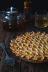 English meat pie. Pork pie. Traditional British pie. Freshly baked homemade savory pies with golden crust. Pie with pastry decoration on top. Food photography, food styling.
