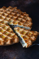 English meat pie. Pork pie. Traditional British pie. Freshly baked homemade savory pies with golden crust. Pie with pastry decoration on top. Food photography, food styling.