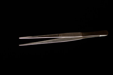 surgical instruments on a black background
