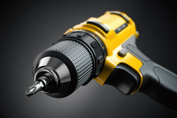 Yellow electric screwdriver drill  close up background.