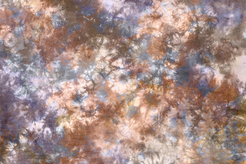 Obraz na płótnie Canvas colorful tie dye pattern hand dyed on cotton fabric background.