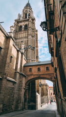 View of Toledo's cathedral bell tower and a shed among buildings - obrazy, fototapety, plakaty