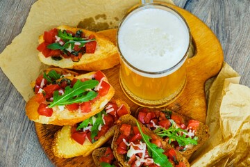 Beer drink bruschetta sausages pizza. snack for beer.