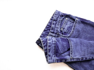 Purple jeans close-up on a white background. Belt and jeans pockets very peri