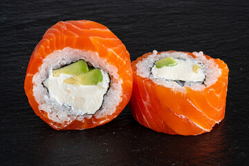 tasty sushi with salmon and vegetables
