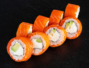 tasty sushi with salmon and vegetables
