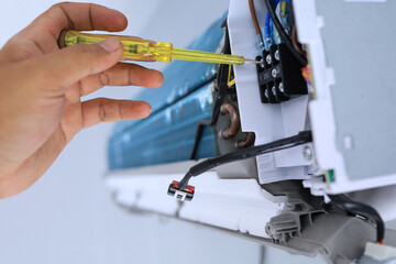 Engineers are using electrical checks to check the operation of air conditioners during annual...