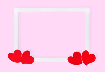 White frame with hearts on pink background