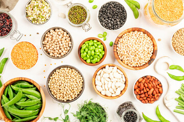 Legumes, beans and sprouts. Dried, raw and fresh, top view. Red beans, lentils, mung beans,...