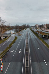 Car empty road - two lanes without cars, rainy gray weather, cityscape. View from bridge (275)