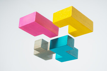 Obraz premium Abstract construction from wooden blocks. The concept of logical thinking..