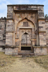 Fototapeta na wymiar Back entrance Gate of Baradari and Dargah of Peer Salauddin, near Motia talab at Raisen Fort, Fort was built-in 11th Century AD, Madhya Pradesh, India.