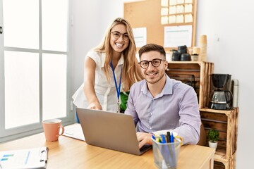 Obraz premium Two business workers smiling happy working at the office.