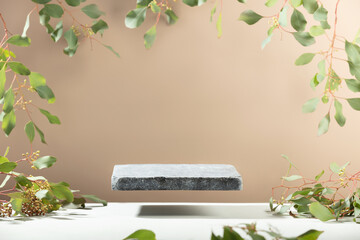 Flying Stone podium for packaging and cosmetic presentation. Monochrome beige template for mockup