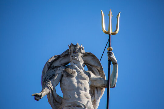 Poseidon statue in the city of Ghent with blue background