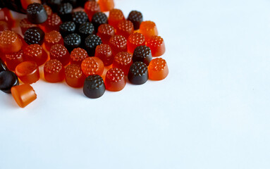 Baby chewing vitamins on a white background close-up