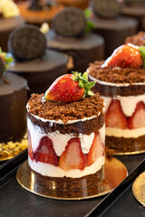 Fruity cake. Small cakes on display at the patisserie counter