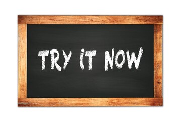 Fototapeta premium TRY IT NOW text written on wooden frame school blackboard.