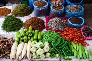 Fresh tropical vegetables and spices on street market. Local morning market in Luang Prabang, Laos.