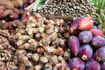 Fresh tropical spices, vegetables and fruits on street market. Local morning market in Luang Prabang, Laos.