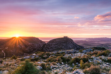 Naklejka premium Glow of the morning sunlight over the beautiful mountain (Castle of Montgri, Catalonia, Spain)
