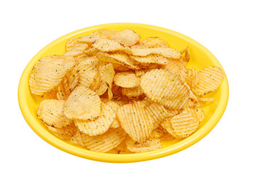 corrugated potato chips on yellow plate isolated on white background