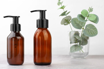 Cosmetics branding mockup. Cosmetic bottles with a dispenser. Natural organic cosmetics for personal hygiene.