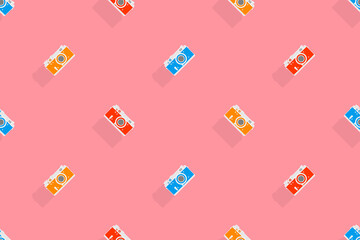 Seamless pattern from old drawn cameras. Background on the theme of photography and photographic equipment.