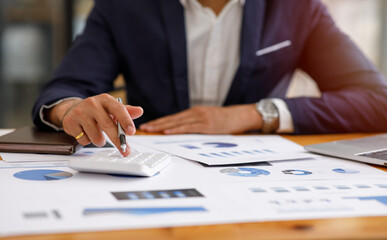 Financial planning Report ,Businessman working at office with documents on his desk, doing planning analyzing the financial report, business plan investment, finance analysis concept