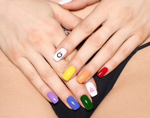 Woman hands with LGBT rainbow flag and rose triangle manicure covering pubis. Symbol of lesbian,...