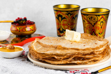 Shrovetide Maslenitsa festival. Russian pancakes blini. Pancakes with honey and jam. Russian spoons. National russian festival. Russian crepes.