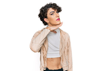 Handsome man wearing make up and woman clothes cutting throat with hand as knife, threaten...