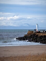 View towards snow capped peaks on the Isle of Arran from Ayr beach
