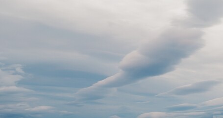 Epic clouds in motion over a blue sky.