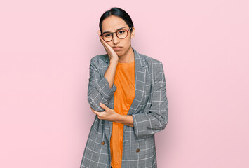 Young hispanic girl wearing business jacket and glasses thinking looking tired and bored with...