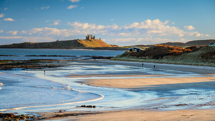 Low Newton Beach and Dunstanburgh Castle, part of the coastal section on the Northumberland 250, a...