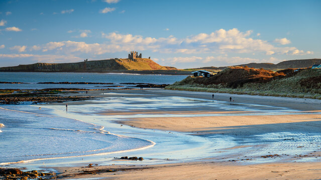 Low Newton Beach and Dunstanburgh Castle, part of the coastal section on the Northumberland 250, a scenic road trip though Northumberland with many places of interest along the route