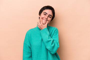 Young caucasian woman isolated on beige background doubting between two options.