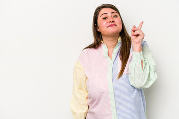 Young caucasian overweight woman isolated on white background showing number one with finger.