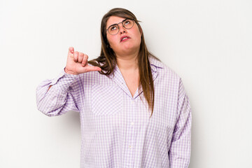 Young caucasian overweight woman isolated on white background showing a dislike gesture, thumbs...