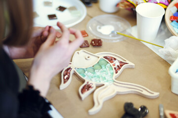 The process of creating a fish from a mosaic. 