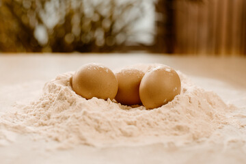 Cooking homemade dough, flour and eggs on the table. Cooking at home, recipes, diet. Pie or cake dough, sweet.