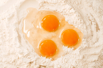 Cooking homemade dough, flour and eggs on the table. Cooking at home, recipes, diet. Pie or cake dough, sweet