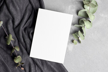 Greeting or invitation card mockup with natural dry eucalyptus twigs