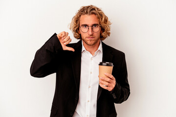 Young caucasian business man holding coffee isolated on white background showing a dislike gesture,...