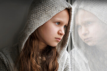 Sad Stressed Depressed Teenager. Unhappy Teen Portrait Close up. Lonely Teenager at Window. Face...
