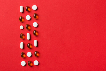 Many different pills and space for text on colorful background, top view. Different pills on color background, flat lay