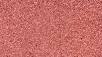 Textured painted brick-colored cement surface. Can be used as backdrop or overlay. Old grunge red wall texture background.